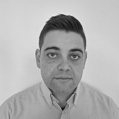 Headshot of Enislav Enikov, greyscale